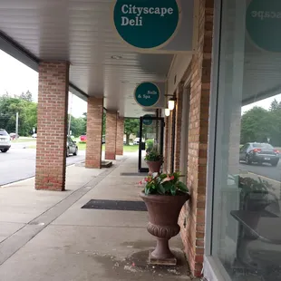 the entrance to a deli shop