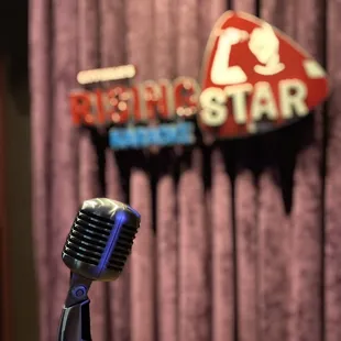 a microphone in front of a sign