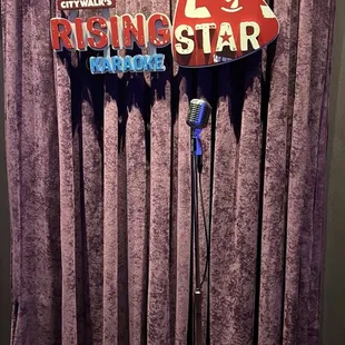 a microphone and sign