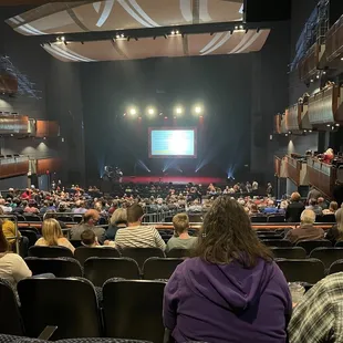 a large auditorium full of people