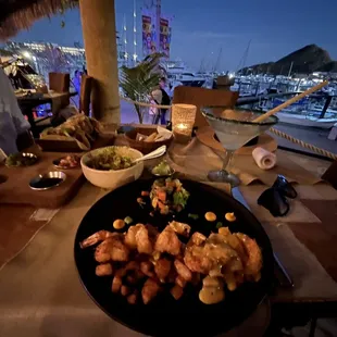 View of marina and my coconut shrimp plate that had cooked cinnamon apples around it.