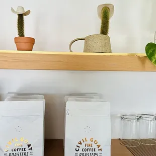 two bags of coffee on a shelf