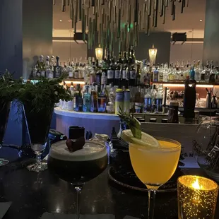 two cocktails on a bar