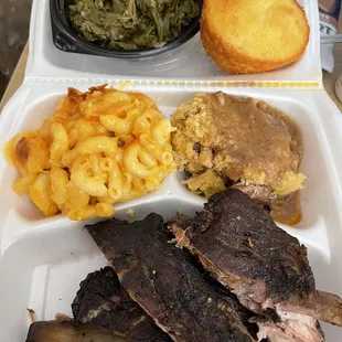 Spare ribs (sauce on the side) with dressing, mac, and collards.