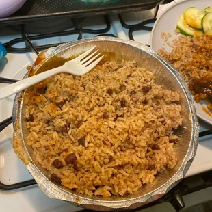 a pan of rice and a plate of zucchini