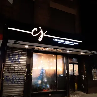 the front of the restaurant at night