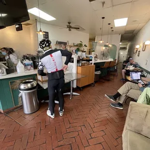 a man standing in a coffee shop