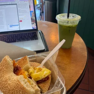 Iced pistachio Matcha drink &amp; sunrise bagel with bacon on sesame