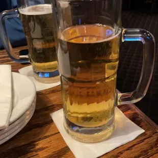 two glasses of beer on a table