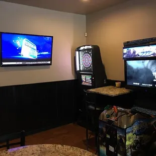 two arcade machines and a television