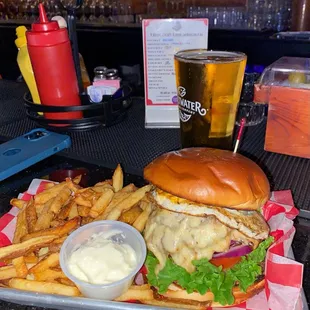 Burger with white American cheese and fried egg