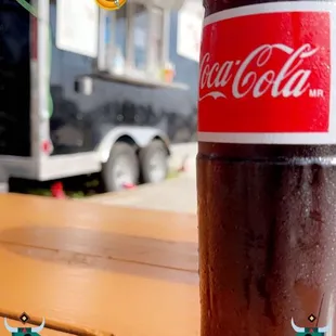 Are you really having Mexican without a medio litro of Coca-Cola en una botella de vidrio?