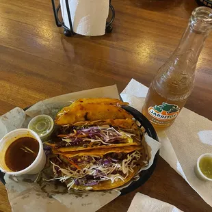 Queso burrita tacos- made with BBQ Brisket and with dipping consumé.
