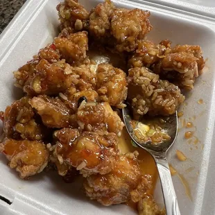 The orange chicken with sauce requested on the side and not on the rice. That obviously was on the rice and has sauce on it.