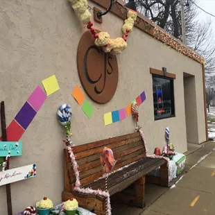 a wooden bench with decorations on it