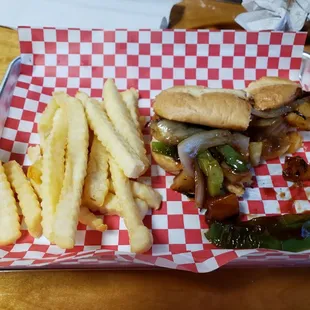 Kielbasa sub, sauteed with green peppers, onions, pineapples, and the house's original BBQ sauce, served on a hoagie, with french fries.