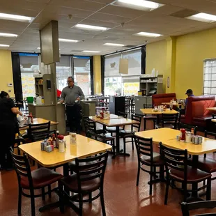 a man standing in the middle of the dining room