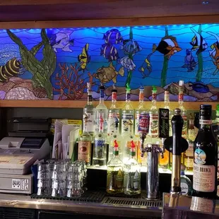 a bar with a lot of liquor bottles