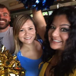 a group of cheerleaders posing for a picture