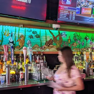 Stained glass behind the bar.