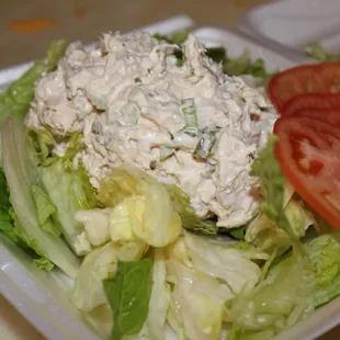 a salad in a styrofoam container