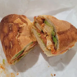 chicken lickin' (dutch crunch roll, lettuce, tomato, kosher pickles)