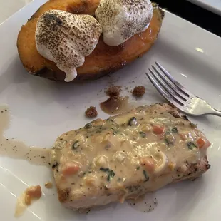 Mahi Mahi with delicate white wine cream sauce &amp; baked sweet potato topped with butter &amp; lightly browned marshmallows.