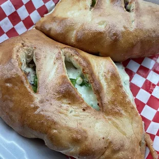 Calzone with onions, peppers, and sausage