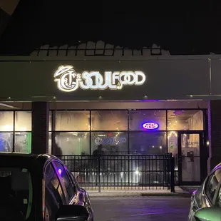 two cars parked in front of the restaurant