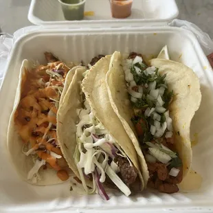 Loco de Pescada taco (fried fish), suadero taco, and al pastor taco - to go