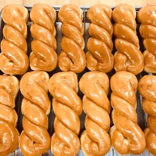 a variety of doughnuts on a cooling rack
