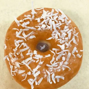 a donut covered in coconut flakes