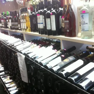 rows of bottles of wine on shelves