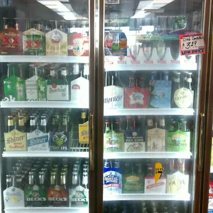 a refrigerator full of alcohol bottles