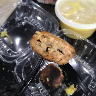 a half eaten sandwich and a cup of soup