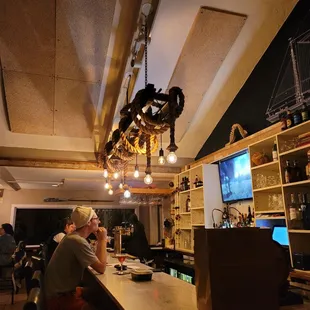 a man and a woman sitting at a bar