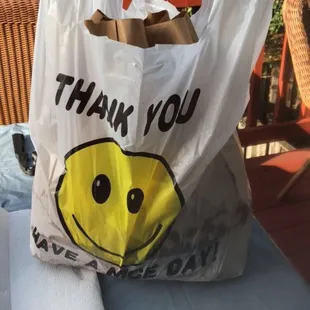 a plastic bag with a smiley face on it