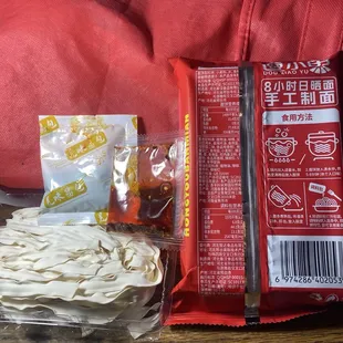 Noodles &amp; chili oil left. Back of package at right. (All Chinese no English)