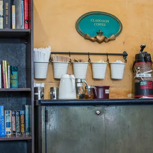 Reading materials next to the coffee add-ins.