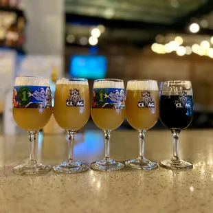 a row of glasses of beer