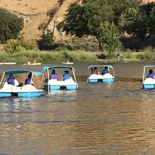 Four couples out on the water having fun together.