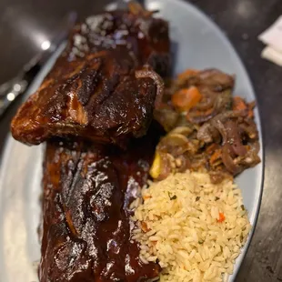 a plate of ribs and rice