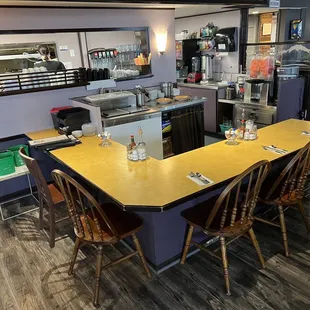 a table and chairs in a restaurant