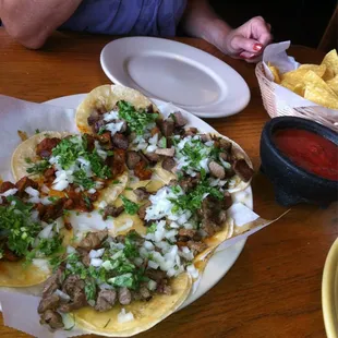 Really good tacos, beef tounge, carne asada, and carne pastar (orange-ish).