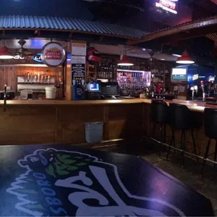 a bar with neon signs