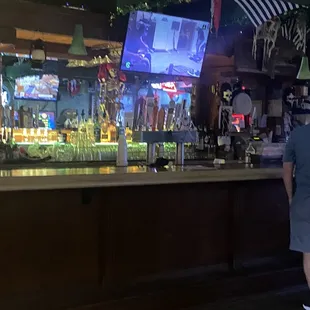 a man standing at the bar