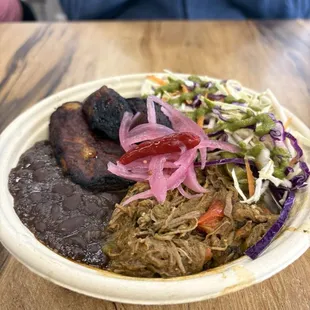 Ropa vieja from Clandestina. Comes with beans, plantains, rice and a salad.