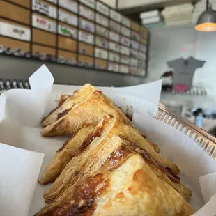 three pastries in a basket