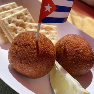 a plate of food with crackers and a flag
