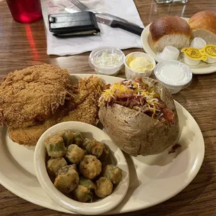 This INCREDIBLE catfish dinner (two HUGE fillets). Two side options. Also a house salad (already eaten) .